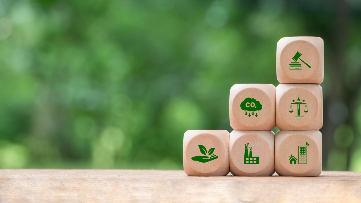 Wooden block with environmental law icons. Concept of international law environmental protection, environmental impact assessment, Eco friendly law, eco balance, business corporate and industry.